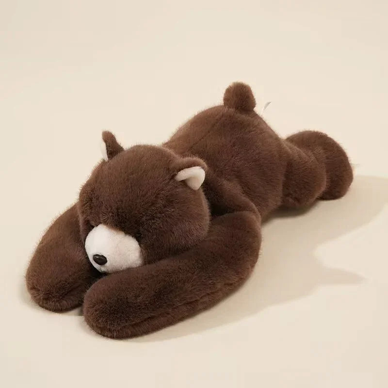 Plush brown bear stuffed animal lying down on a neutral background