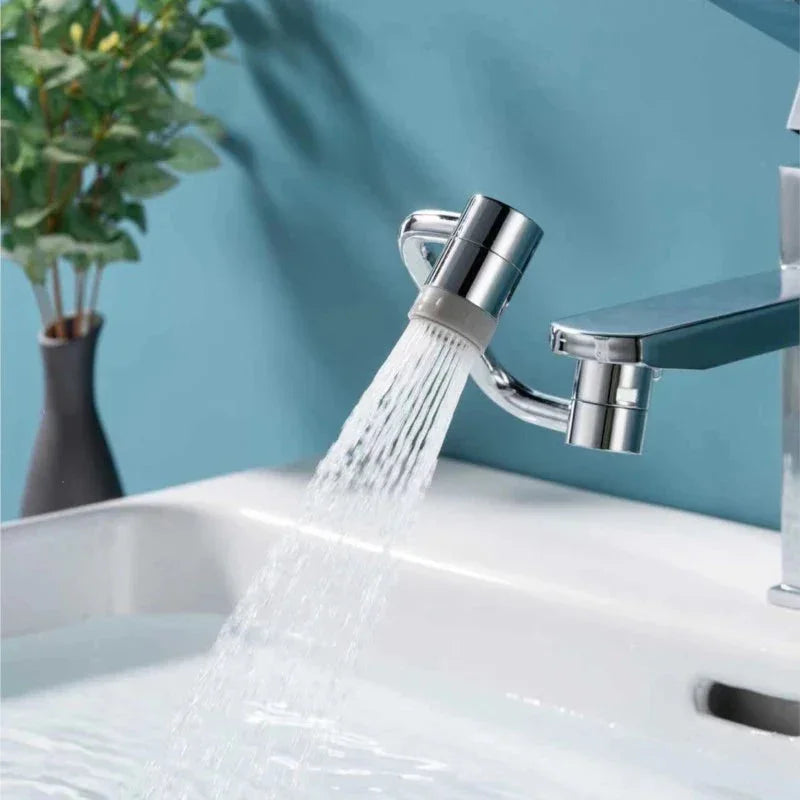 Adjustable chrome faucet with water aerator spraying into a white sink, modern bathroom decor