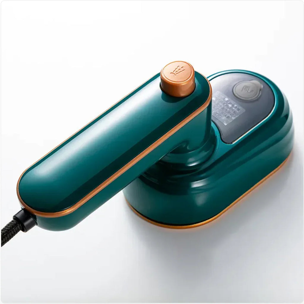 Modern handheld garment steamer with teal and gold finish on white background
