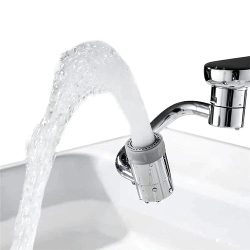 Adjustable faucet sprayer attachment with angled water flow in a kitchen sink