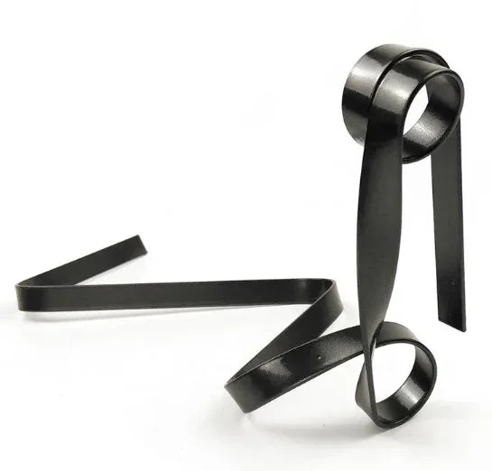 Black metal decorative art sculpture with modern abstract design on white background