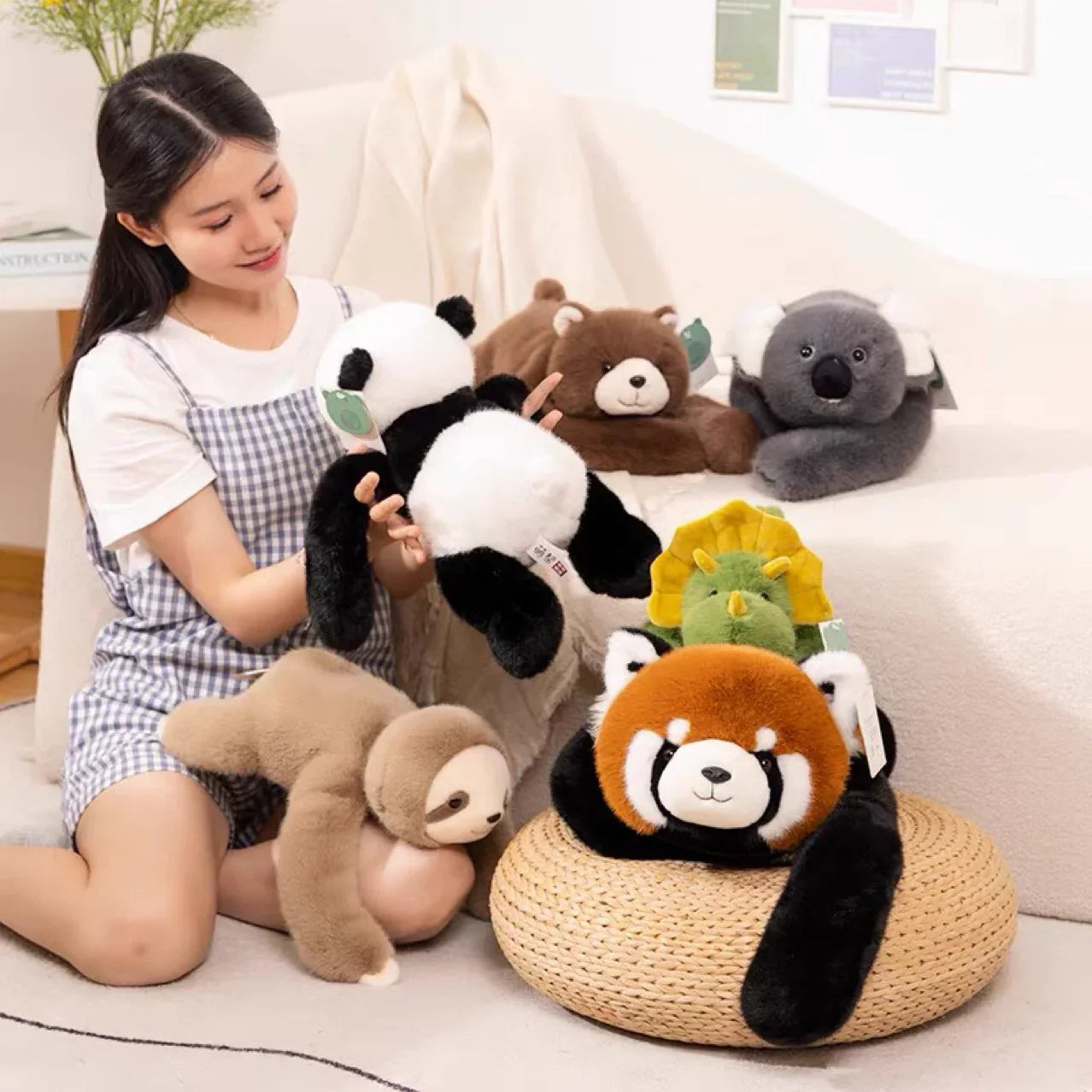 Woman with assorted animal plush toys including panda, sloth, koala, bear, dinosaur, red panda